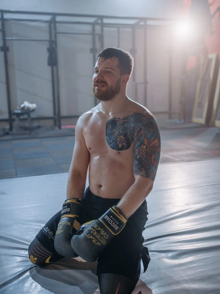 Marcus Velez — UFC bantamweight, photographed wrapping hands in his fight-week locker room.